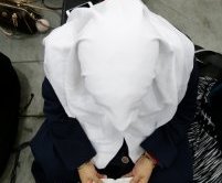 A woman reads prayers before Muhammad Ali's Jenazah, a traditional Islamic Muslim service, in Freedom Hall, Thursday, June 9, 2016, in Louisville, Ky.